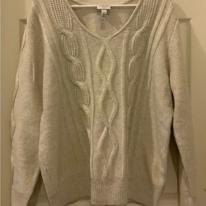 Cream color sweater.